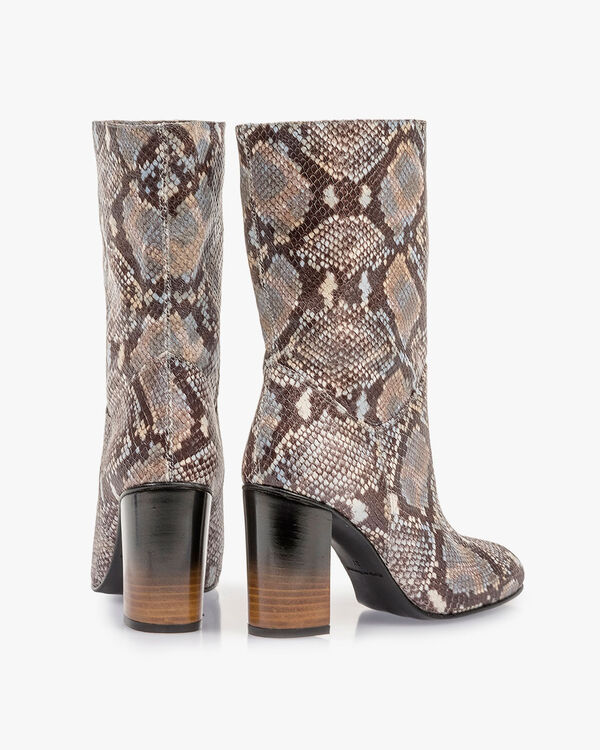 Brown and white leather boots with snake print
