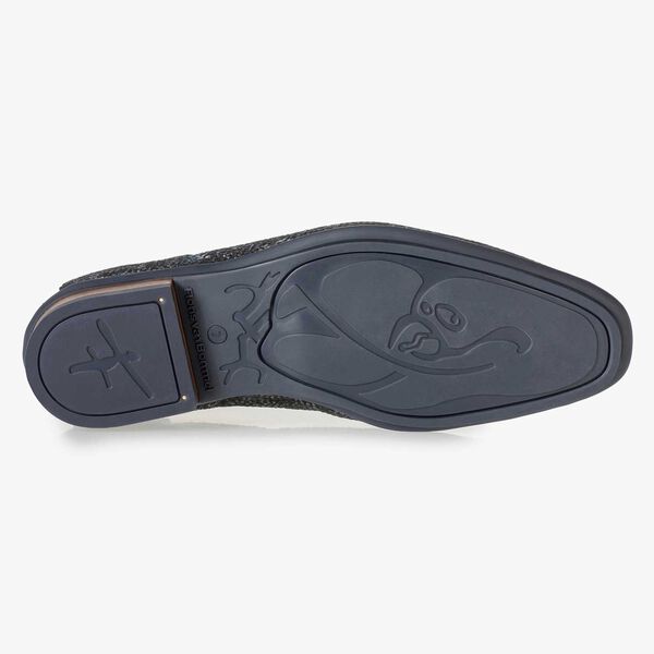 Dark blue leather lace shoe with an organic texture