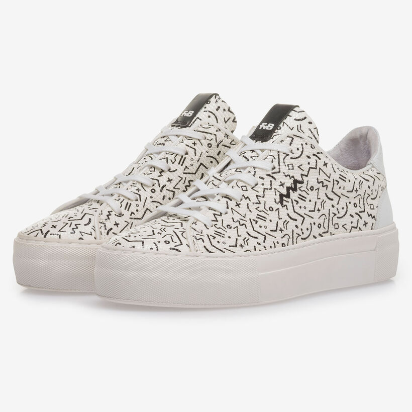 White leather sneaker with black print